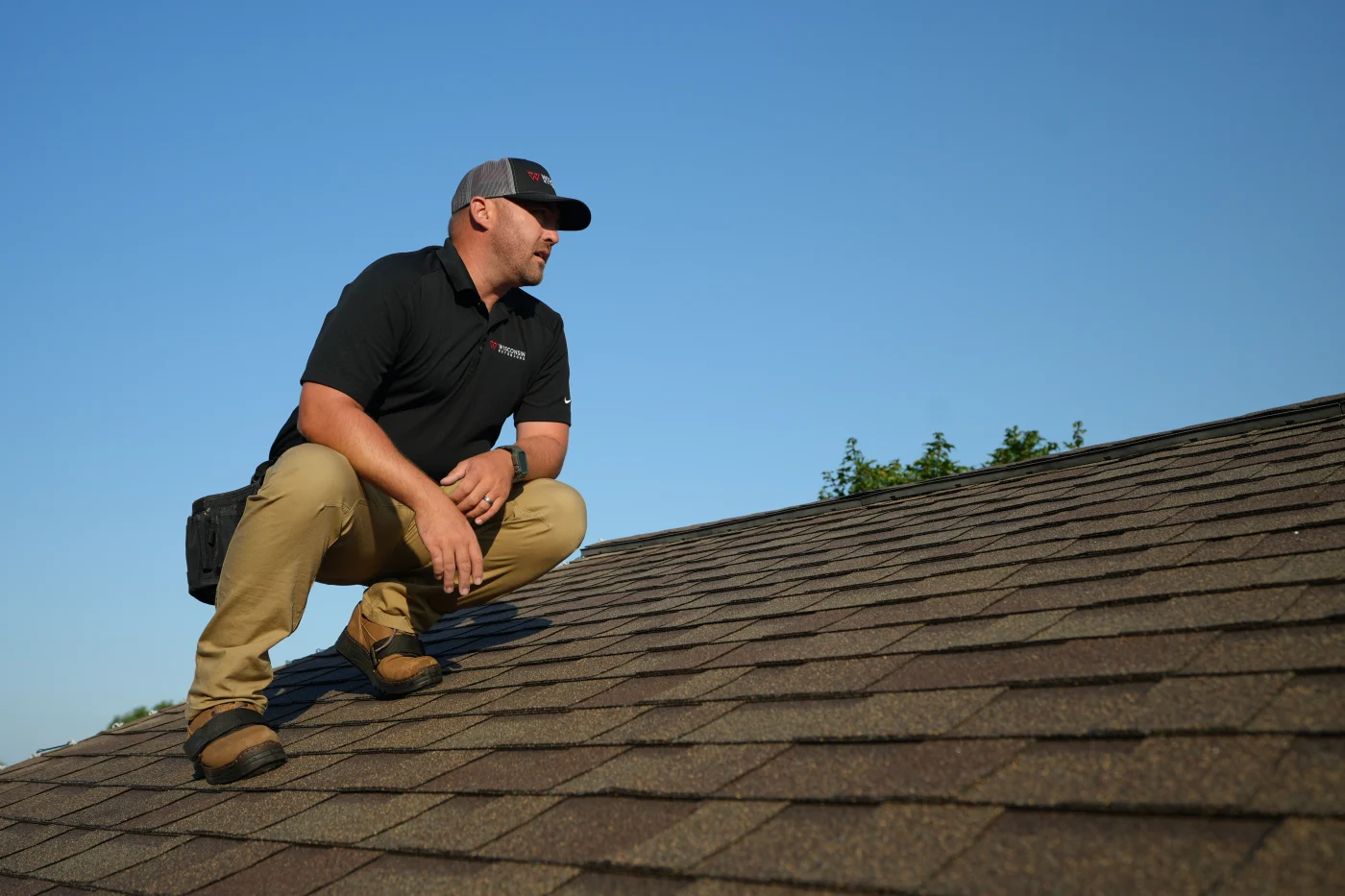 All You Need To Know | Wisconsin Exteriors | Greater Kaukauna Owner of Wisconsin Exteriors pointing out home siding damage to a homeowner