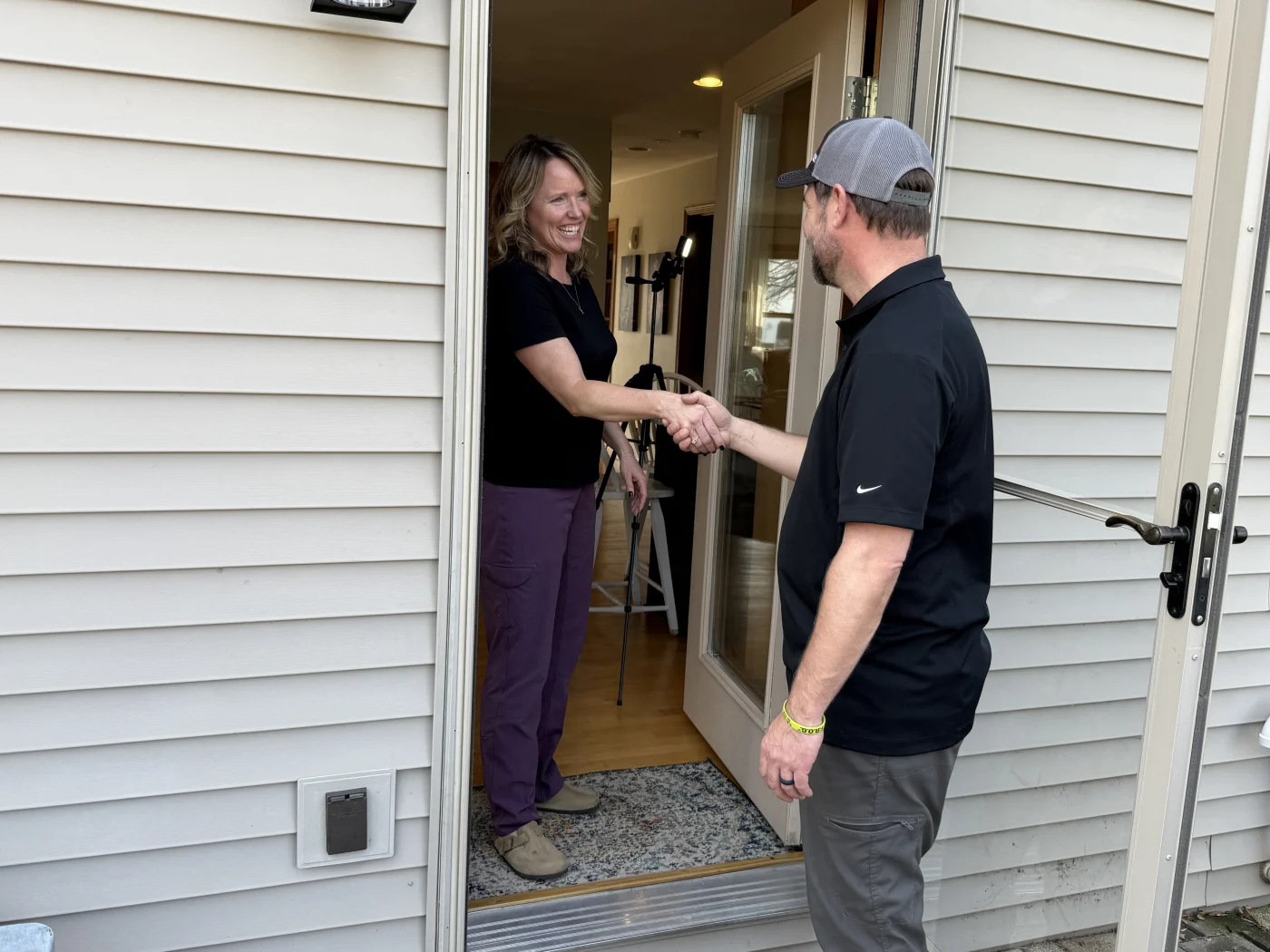 Kaukauna homeowner speaking with owner of Wisconsin Exteriors about roofing project
