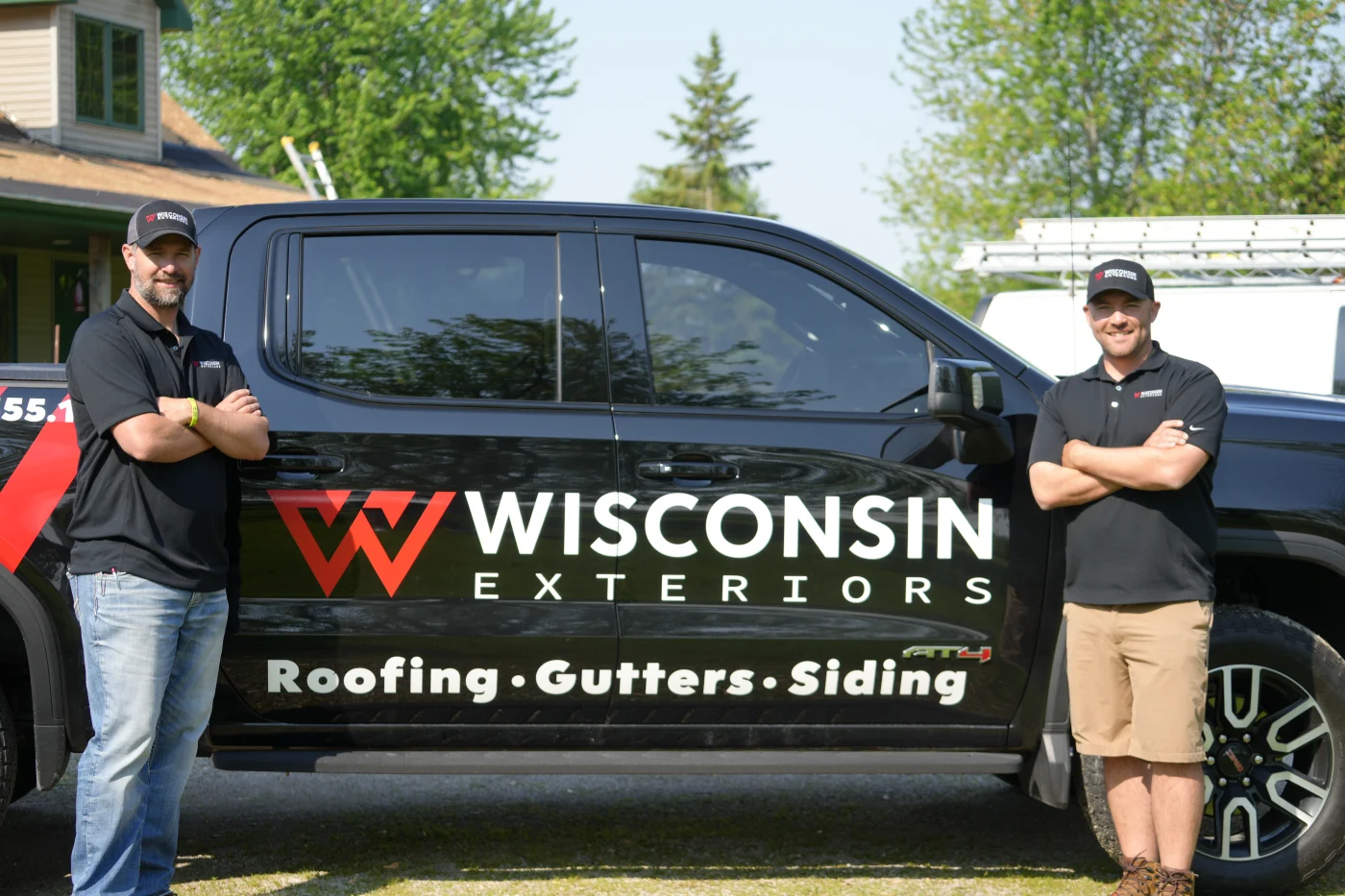 Our Story | Wisconsin Exteriors | Kaukauna Both owners of Wisconsin Exteriors smiling in front of company truck
