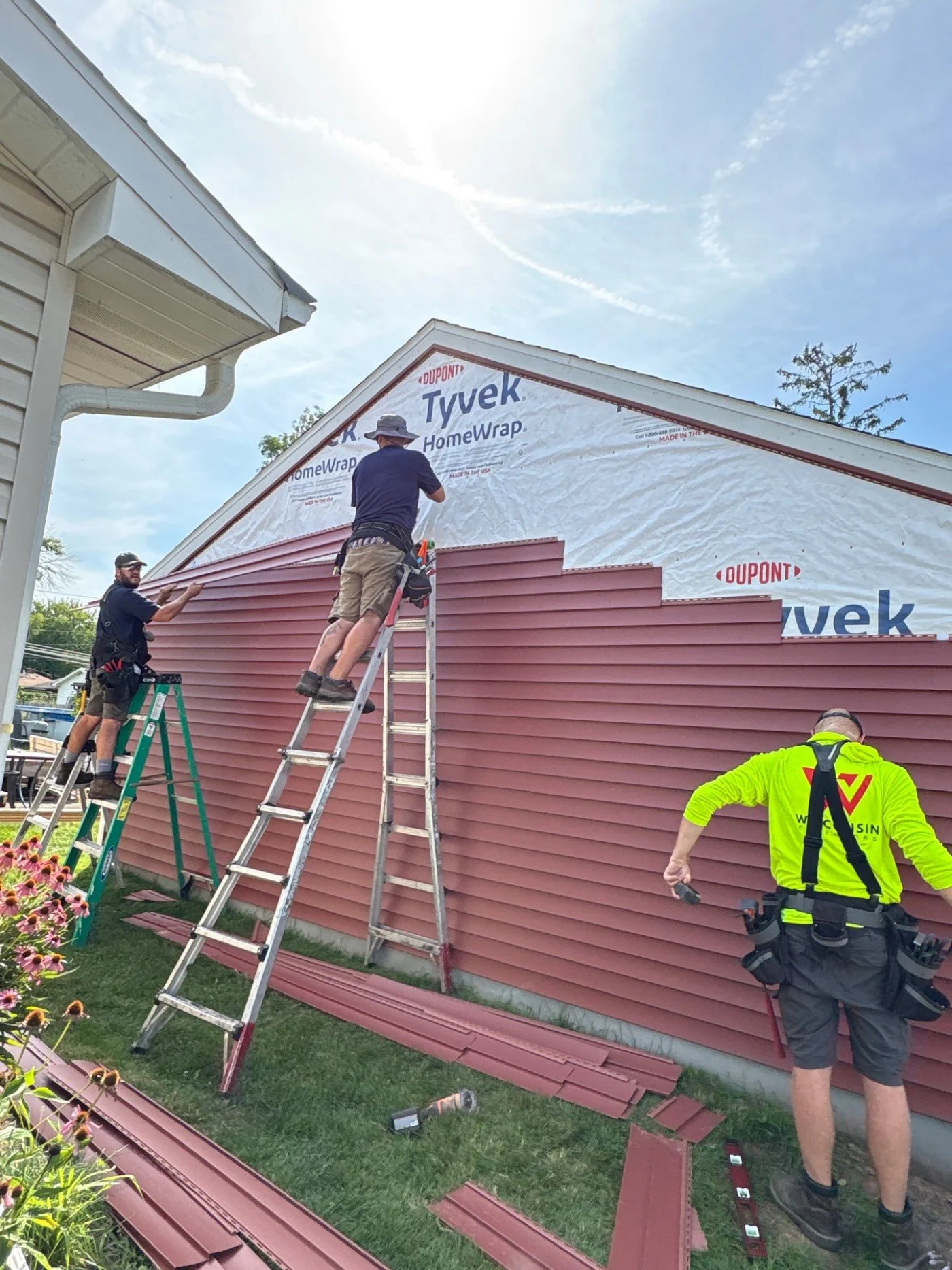 Better Siding Installation Kaukauna Wisconsin Exteriors Wisconsin Exteriors crew installing new siding on Kaukauna home
