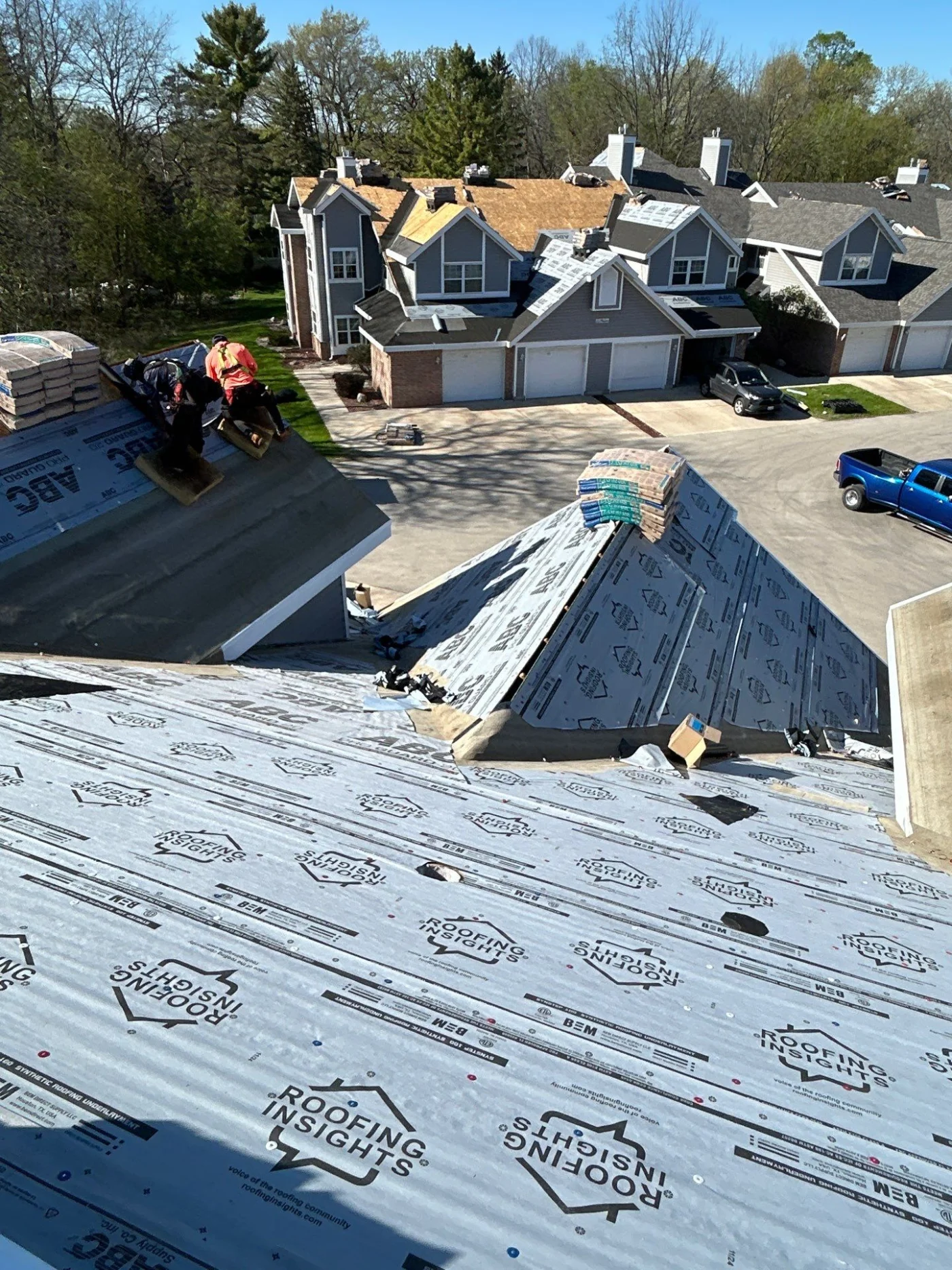 Expert Multifamily Roof Replacement | Kaukauna | Wisconsin Exteriors Multiple multifamily homes with new roofs being installed by Wisconsin Exteriors