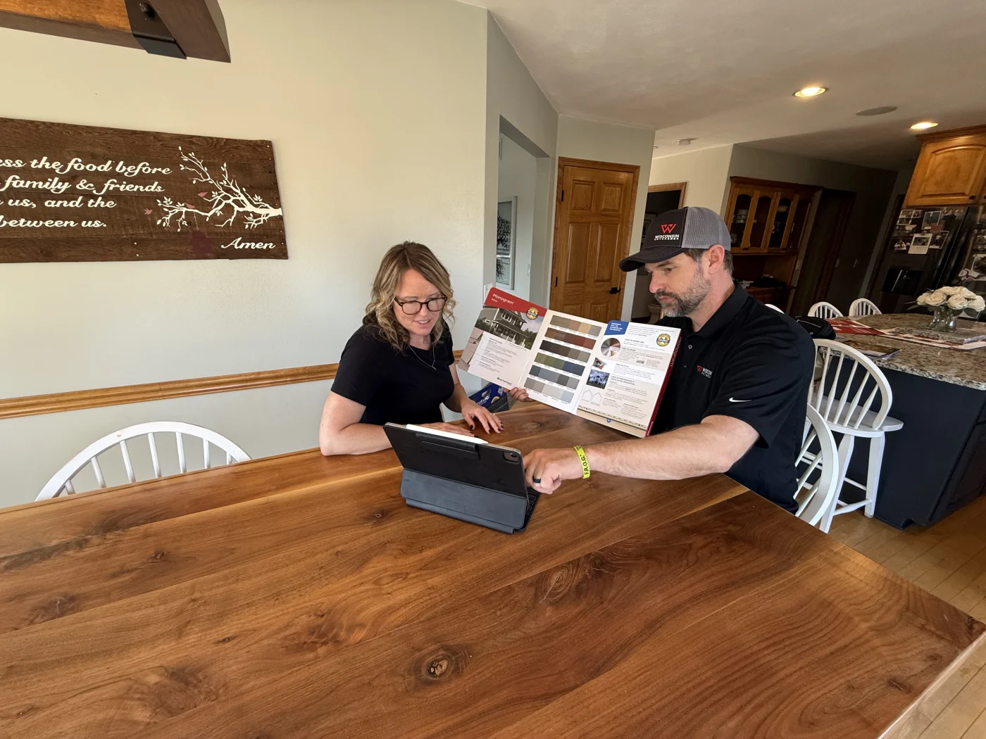Trusted Financing | Wisconsin Exteriors | Kaukauna Owner of Wisconsin Exteriors discussing payment options and financing with homeowner