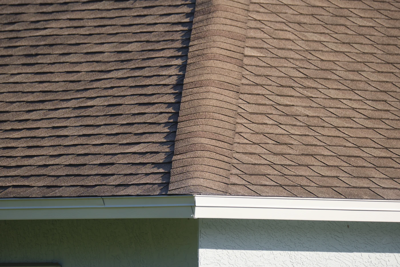 A close-up view of brown shingles on a roof.
