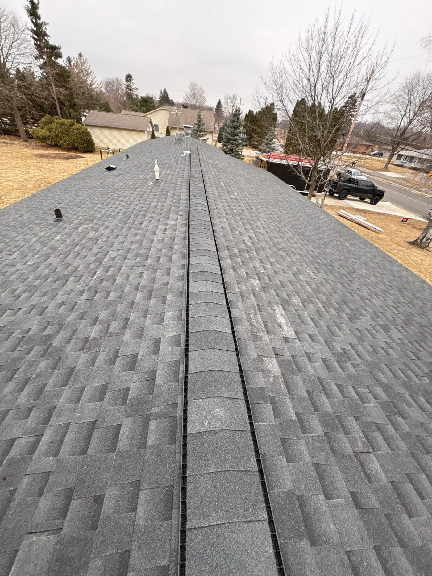 Durable Roofing Neenah Wi Wisconsin Exteriors A close-up view of an asphalt shingle roof on a house
